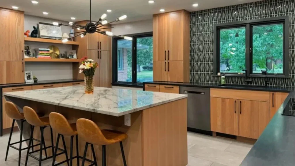 Modern kitchen renovation with white cabinets, quartz countertops, and LED lighting